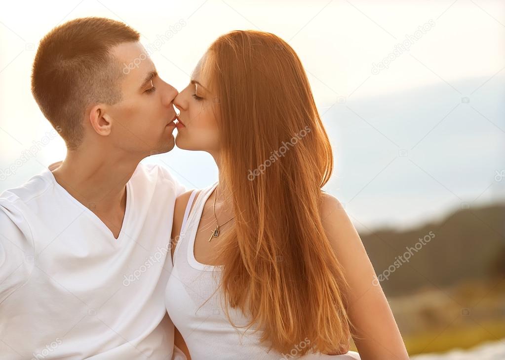 happy couple in love at sunset in the mountains