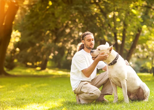 Man and Dog Argentino walk in the park. — Stock Photo, Image