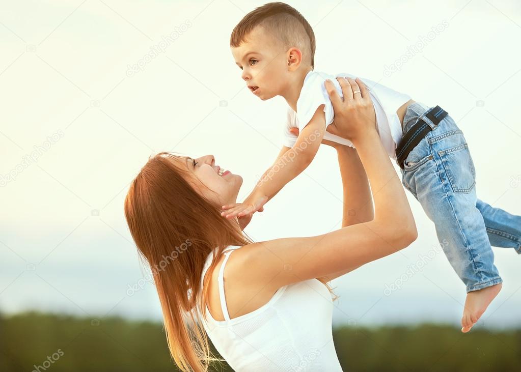 happy mother and son in the mountains playing