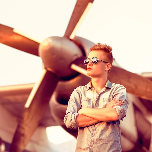 Fashion man near helicopters at the airport — Stock Photo, Image
