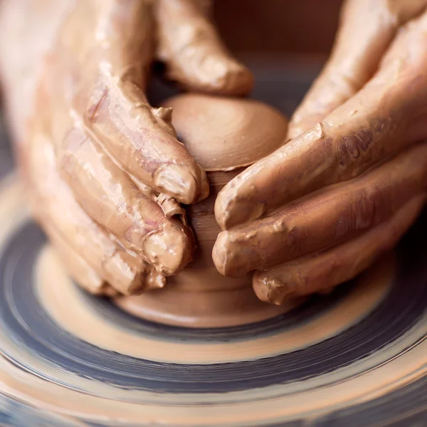 Hands working on pottery wheel — Stock Photo, Image