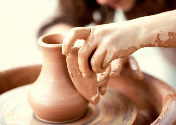 Hands working on pottery wheel — Stock Photo, Image