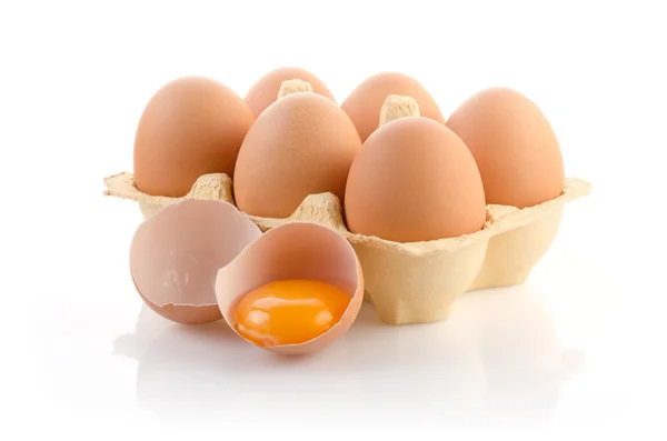 Eggs in the Package with one broken — Stock Photo, Image