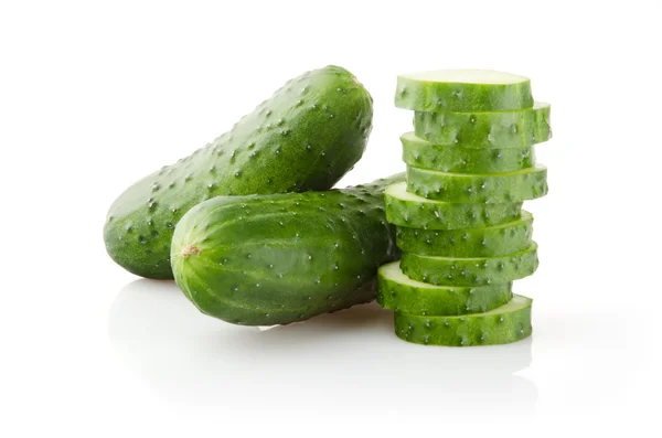 Fresh Cucumbers and Slices on white — Stockfoto