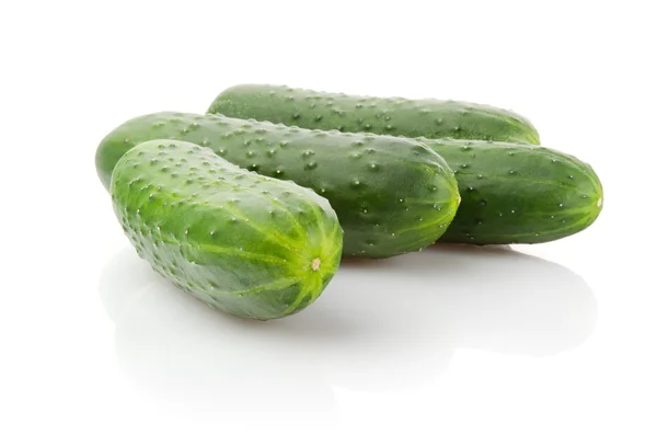 Four fresh Cucumbers on white Stock Fotografie