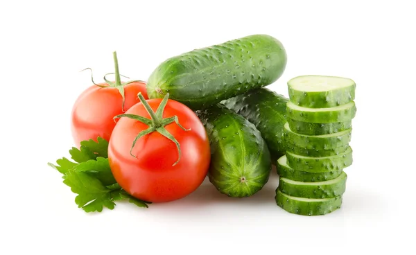 Fresh Tomatoes, Cucumbers and Parsley on white Stock Image