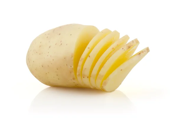 Potatoes and Slices on white Royalty Free Stock Images