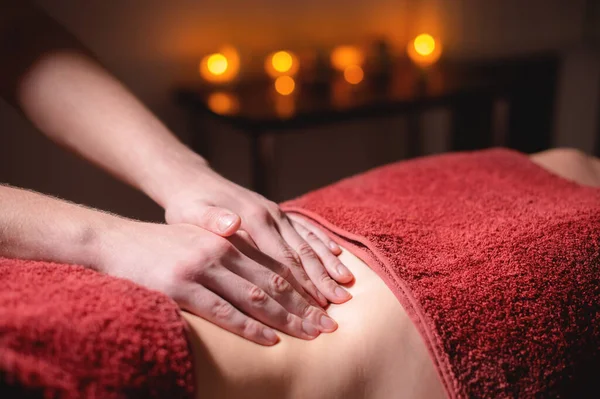 Close-up massage and positioning of the abdomen and internal organs and diaphragm of the abdominal cavity of a woman — Stock Photo, Image