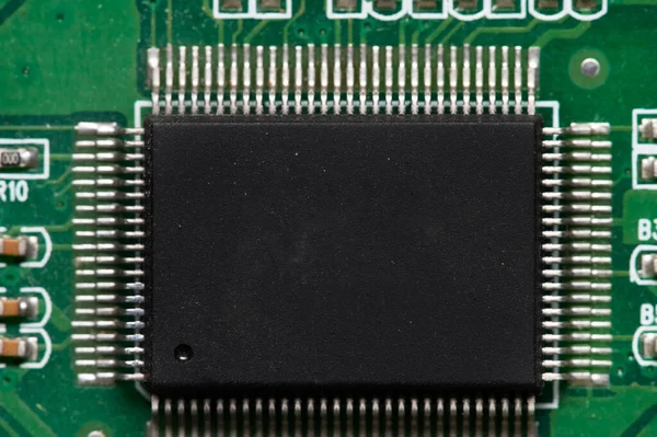 Close-up of computer chip on green pc motherboard microchip — Stock Photo, Image