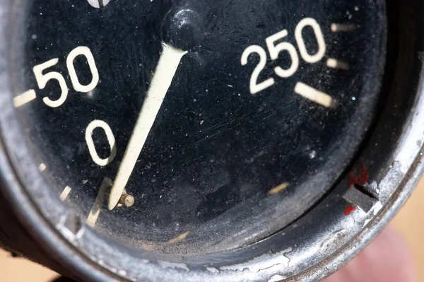 Close-up of an old industrial pressure gauge display with worn protective glass. Macro — Stock Photo, Image