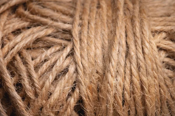 Natural jute twine, macro photography. Jute thread texture. A coil of jute rope. Close-up