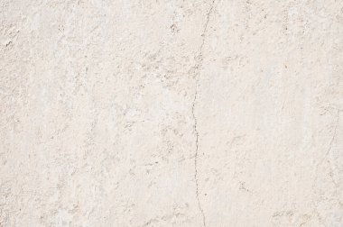 Kırık soyulmuş duvarların arkaplanı ve bej renkte soyulmuş macun..