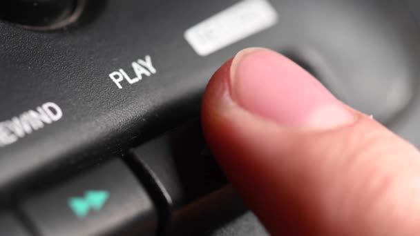 Audio cassette playback. Close-up. Pressing a finger button on an old audio cassette player. Man finger presses the playback control buttons. — Stock Video