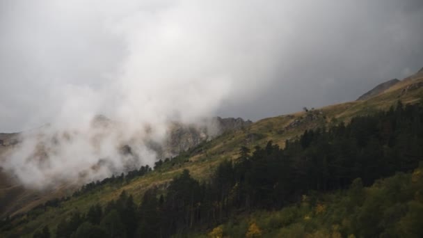 Hand-held panorama. Autumn mountain slopes with clouds hanging in the forest. High dynamic range. Smooth movement — Stock Video