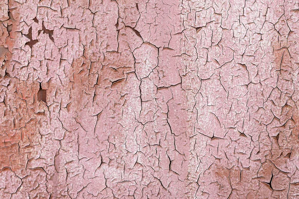 Pink Old flaky paint on a metal surface. Red grunge texture — Stock Photo, Image