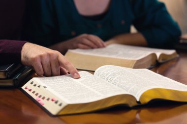 Young Couple Studying The Bible clipart