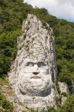  The statue of Decebal carved in the mountain - closeup clipart