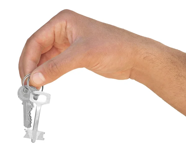 Mão com chave sobre um fundo branco — Fotografia de Stock