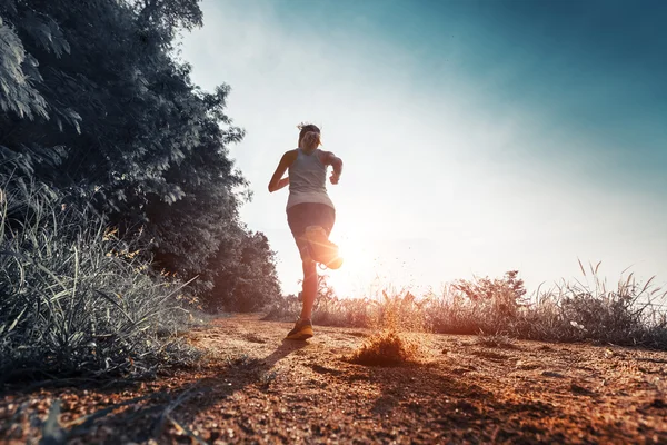 Woman running on the road — Stock Photo, Image