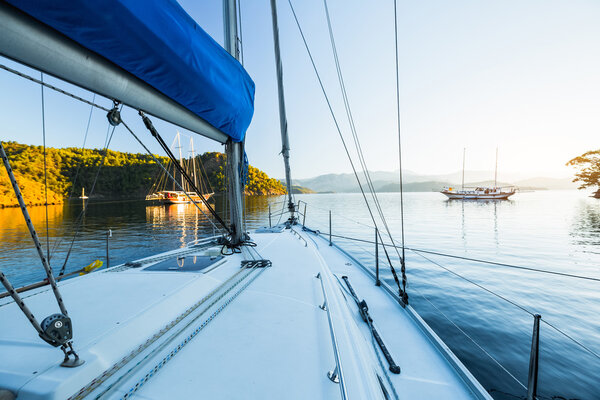 Sailing boats anchored in calm bay