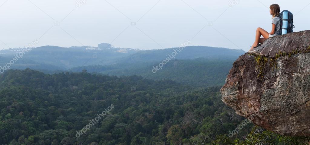 Lady hiker relaxing on top