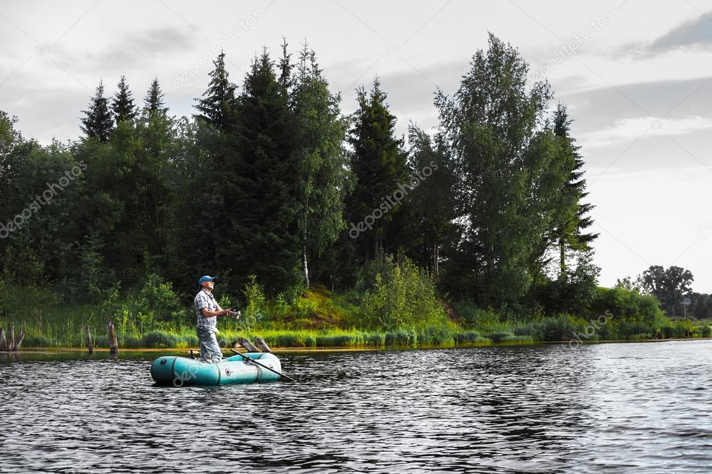 Mature man fishing on the lake