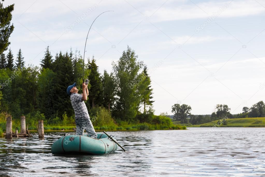 Mature man fishing on the lake