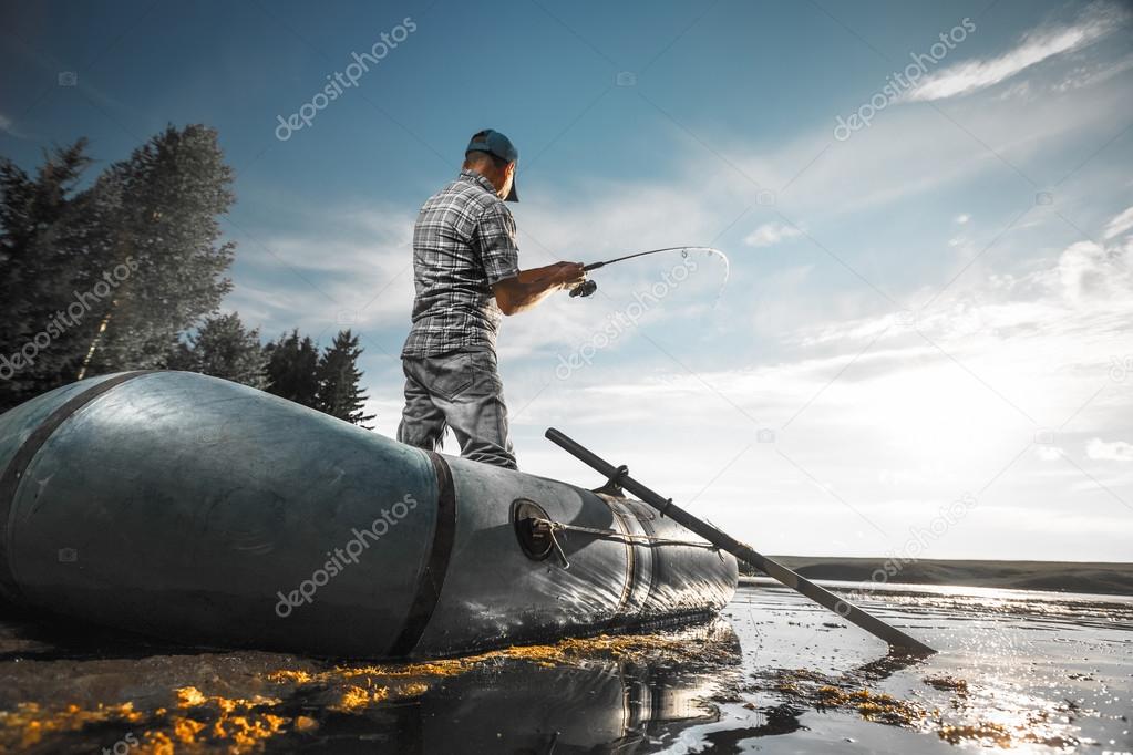 Mature man fishing on the lake