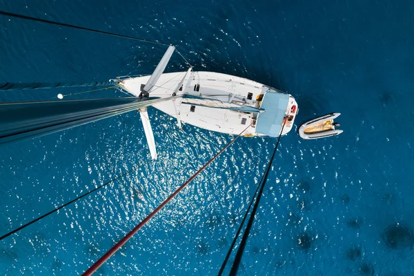 Aerial view of the sailboat anchored