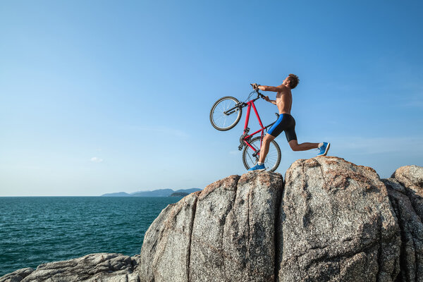 sporty man with bicycle