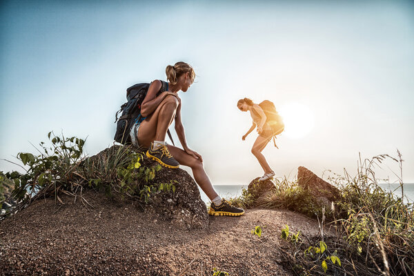 Two hikers on top of a hill