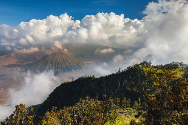 Sunset in a valley with active volcanoes — Stock Photo, Image