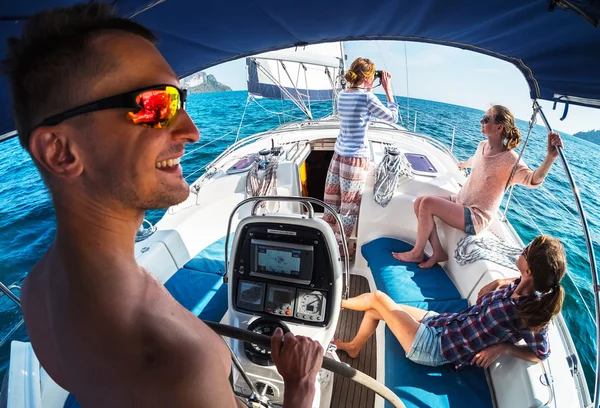 friends sailing in a blue sea