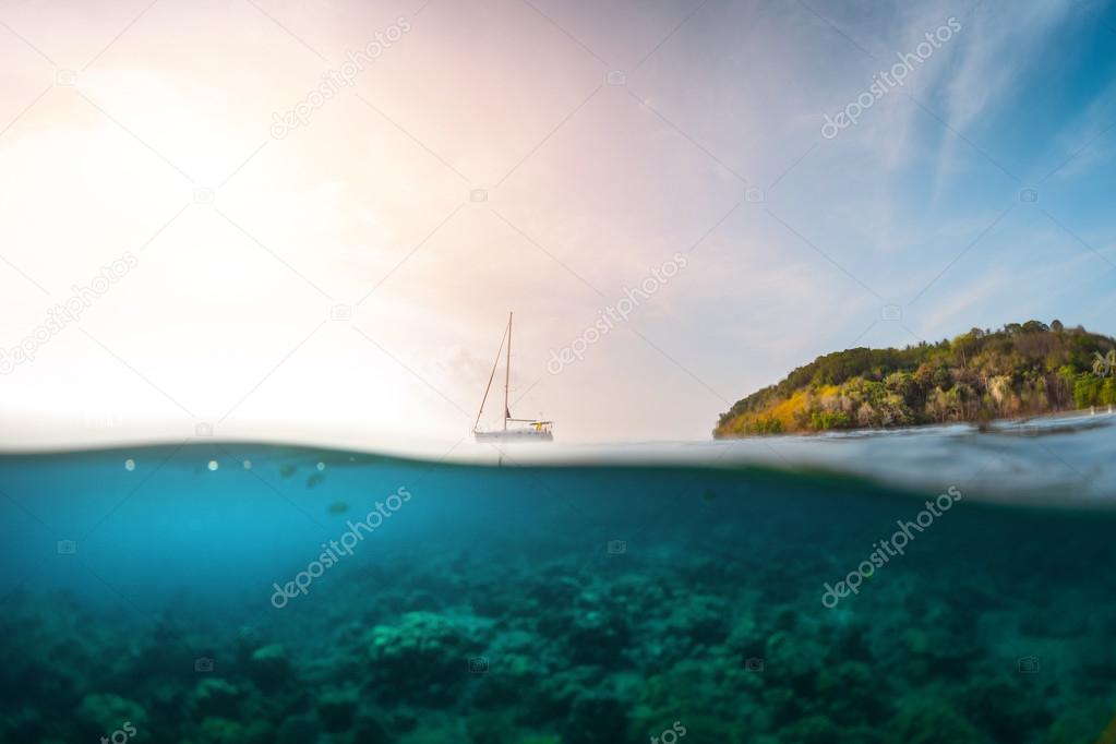 Sailing boat anchored in a tropical sea