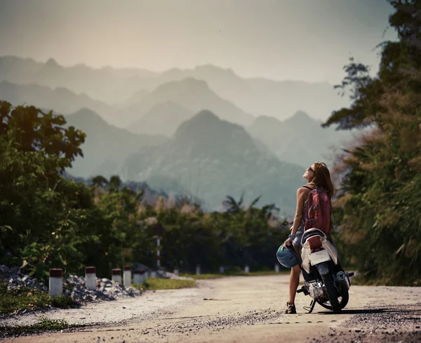 Lady biker near the scooter — Stock Photo, Image