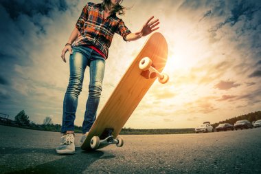 Young lady with skateboard clipart