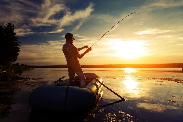 Fisherman in a pond — Stock Photo, Image