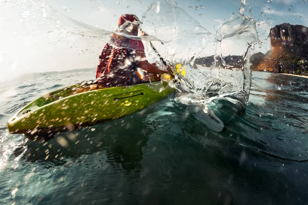 Lady paddling the sea kayak — Stock Photo, Image