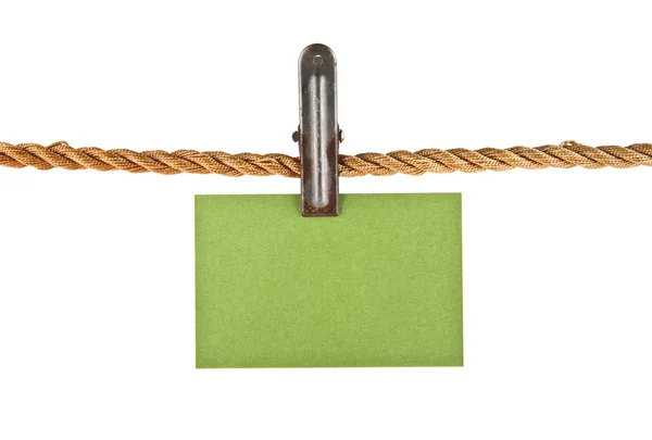 Зеленая бумага на веревке — стоковое фото