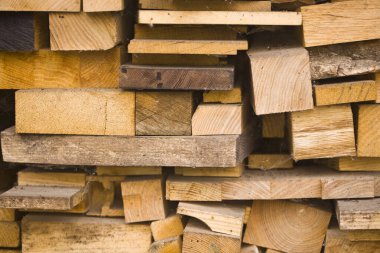 Duvar kağıdı için arka plan olarak kesilmiş odun yığınının dokusu.