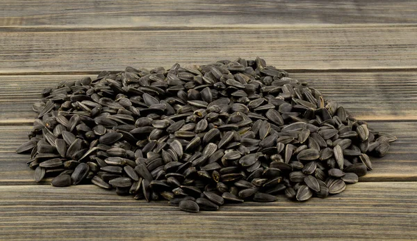 Pile Sunflower Seeds Wooden Table Close — Stock Photo, Image