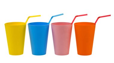 Plastic colored cups isolated on white background close-up. Red, yellow, blue, pink, orange glasses.  Detail for design. Design elements. Macro. Food. The drinks. 