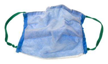 Crumpled old blue medical mask isolated on white background close-up. Detail for design. Design elements. Macro. 