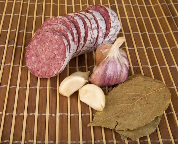 Salame and laurel leaves — Stock Photo, Image