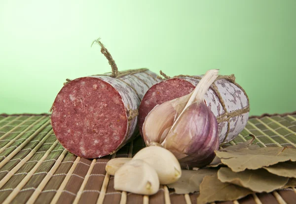 Salame, garlic and laurel leaves — Stock Photo, Image