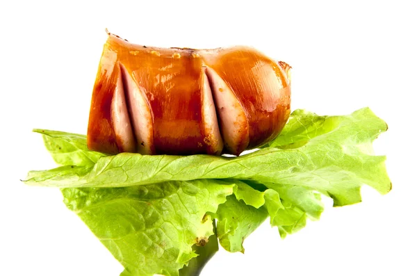 Sausage on lettuce — Stock Photo, Image