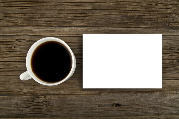 Kopje koffie en papier blad — Stockfoto