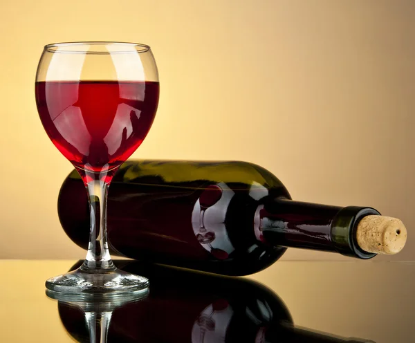 Glass of wine and bottle — Stock Photo, Image