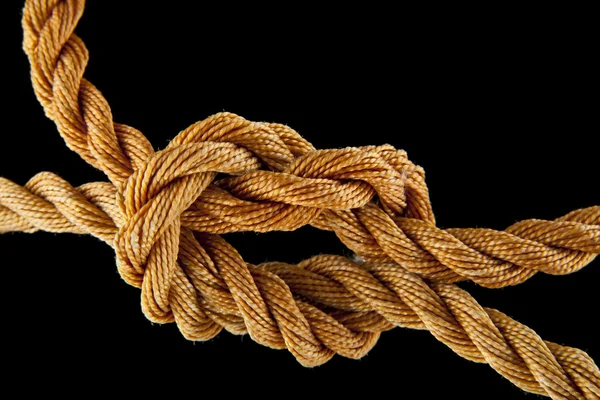 Rope knotted on black — Stock Photo, Image