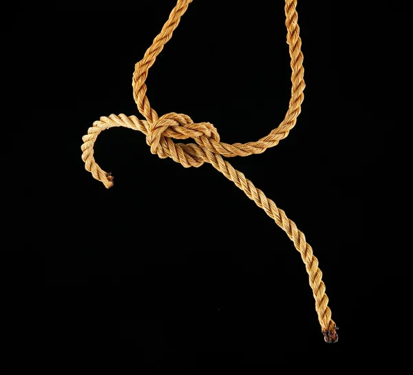 Rope knotted on black — Stock Photo, Image